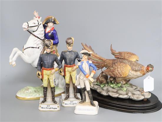 A Capodimonte limited edition model of a pheasant, on oval wood plinth, no. 664/1000 and four military figures